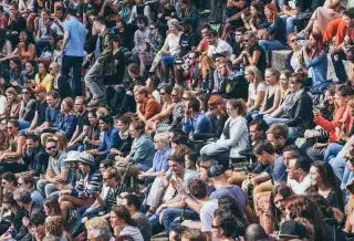 people sitting on stadium