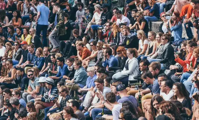 people sitting on stadium