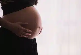 woman holding stomach