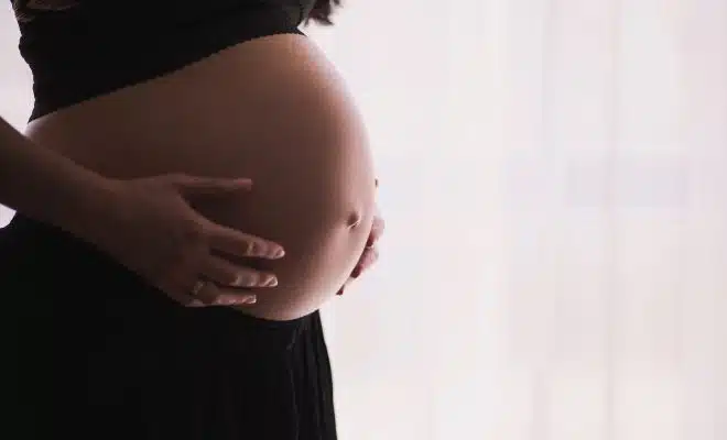 woman holding stomach